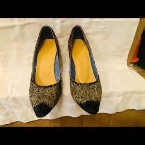 Custom made pheasant feather shoes.